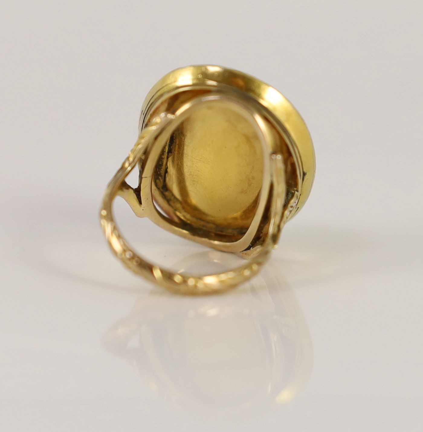 An antique gold mounted sardonyx cameo, possibly carved with the head of a Alexander The Great to sinister, now in later 9ct gold ring mount